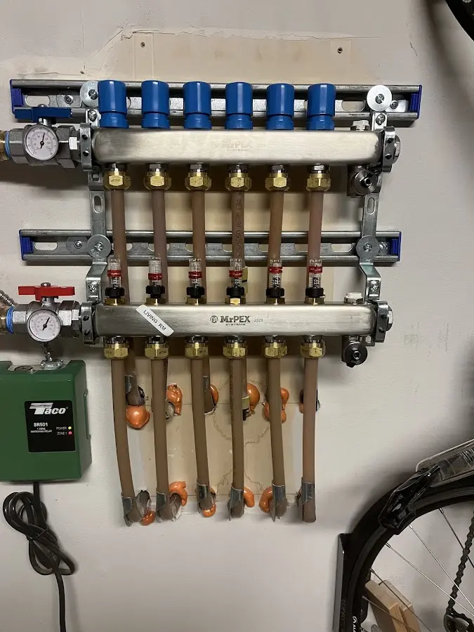 Plumber performing Water Heater Repair at a residential property in St. Albans